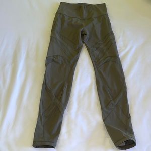 Lululemon army green tights with mesh accents. Used excellent condition. Size 8
